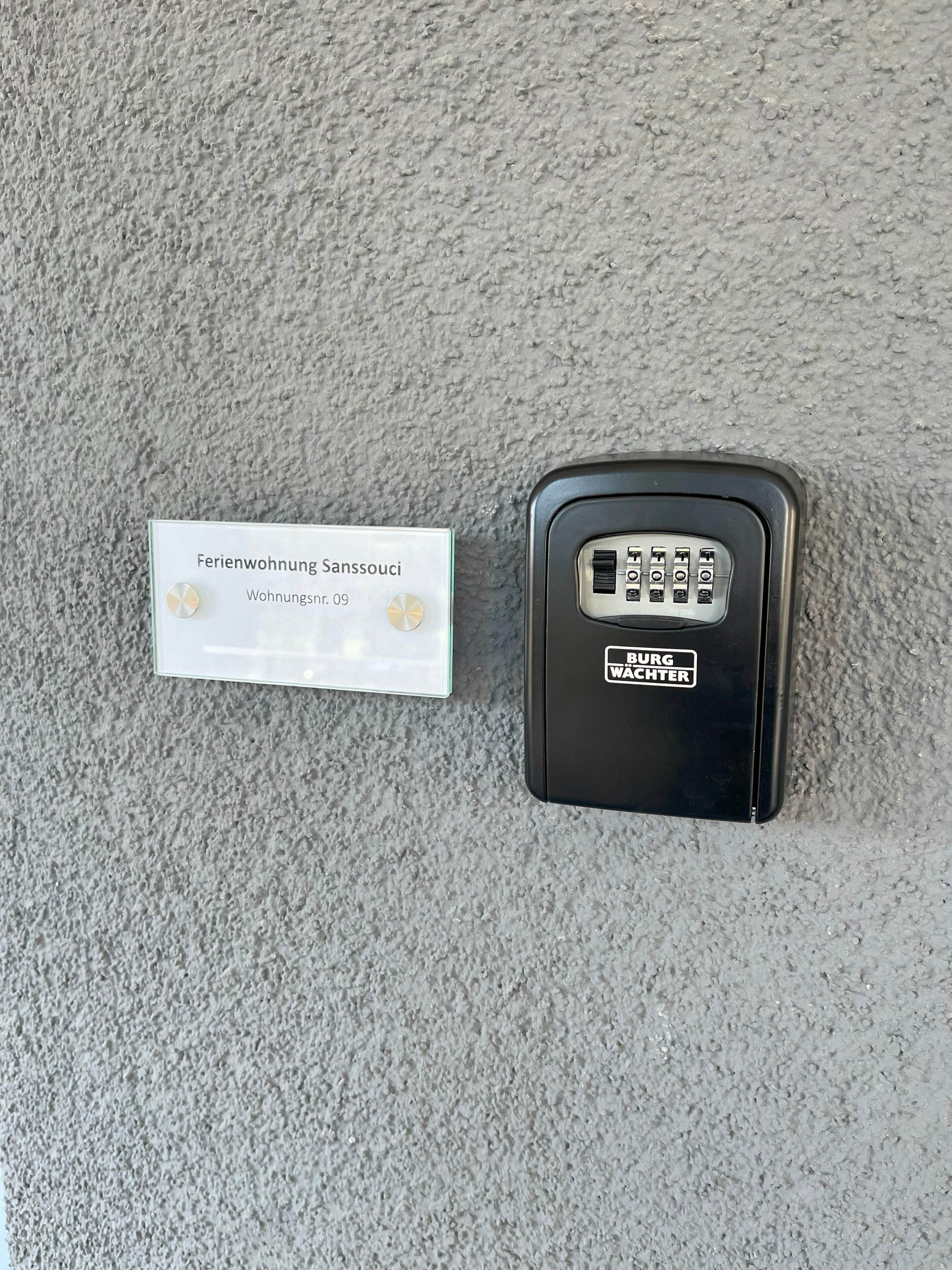 A keycard and a sign indicating a furnished apartment with a room number.
