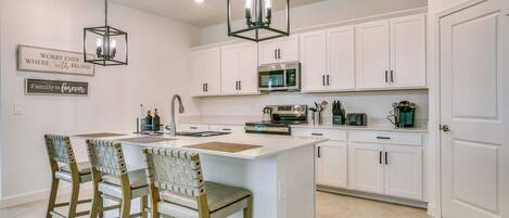 Coffee/tea maker, fridge, microwave, stovetop