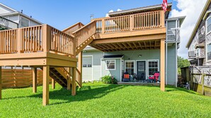 A two-story house with a deck, a front porch, and a garage. - Waterfront Studio w/ Dock, 8 Mi to Kemah Boardwalk (Dickinson)