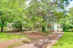 A large house with a porch, surrounded by trees and a grassy yard. - ATL Commuter's Dream! 1/2 Mi to MARTA in Decatur (Decatur)