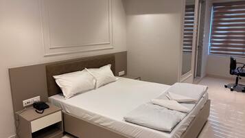 Standard Double Room, City View | Desk, laptop workspace, blackout curtains, soundproofing