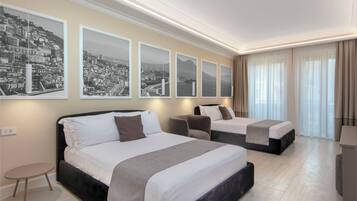 Luxury Quadruple Room, City View | Premium bedding, down comforters, pillowtop beds, minibar