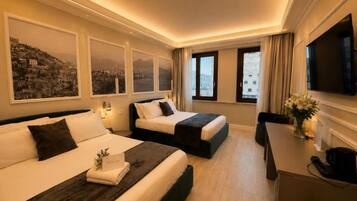 Luxury Quadruple Room, City View | Minibar, in-room safe, desk, laptop workspace
