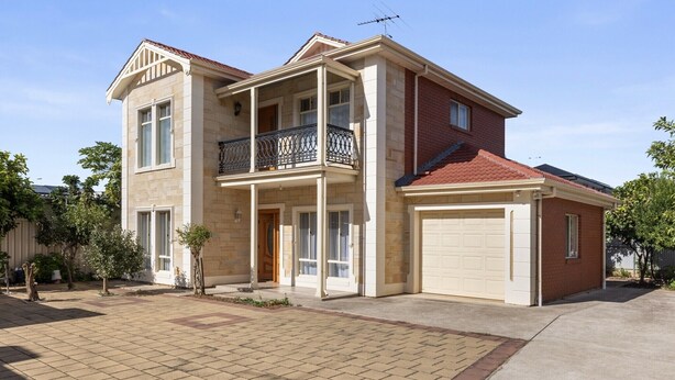 A two-story house with a balcony, garage, and a driveway. - Family-Friendly 4-Bed Home with Parking (Seacombe Gardens)