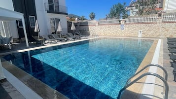 Outdoor pool, free cabanas, pool umbrellas