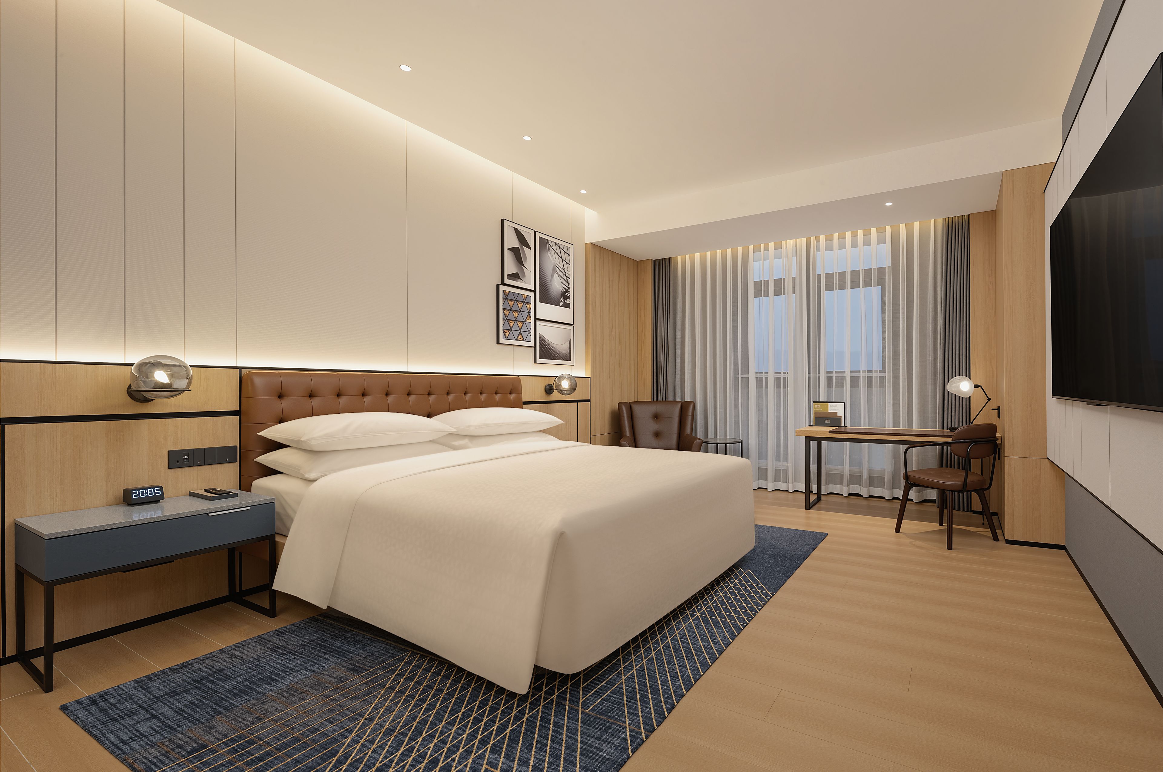 A hotel room with a bed, bedside table, desk, chair, and a TV.