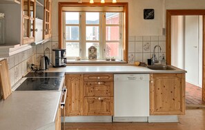 Fridge, stovetop, dishwasher, coffee/tea maker