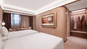 Premium bedding, memory-foam beds, free minibar, desk