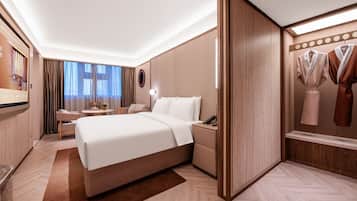 Premium bedding, memory-foam beds, free minibar, desk