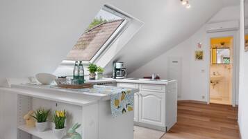 Fridge, stovetop, coffee/tea maker, electric kettle