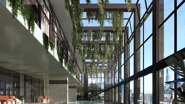 An indoor swimming pool with a glass bottom, surrounded by large windows and indoor plants. - High-rise 2-bed Stay at Queensbridge (Melbourne)
