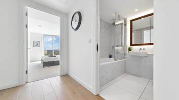 Shower, hair dryer, towels, shampoo