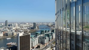 A cityscape with a river, modern buildings, and a Ferris wheel. - ELEVATED SHARD VIEW PANORAMIC SECRET STAY, Top Floor Penthouse, Gym and Rooftop (Greater London)
