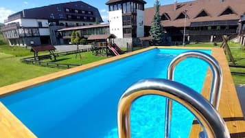 Outdoor pool, pool umbrellas, sun loungers