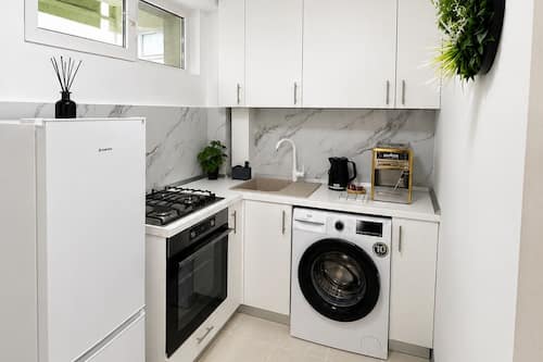 Luxury Studio, 1 Queen Bed, Non Smoking | Private kitchen | Full-sized fridge, oven, stovetop, cookware/dishes/utensils