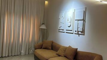 Apartament Deluxe, balcó, vistes a la ciutat | Sala d'estar
