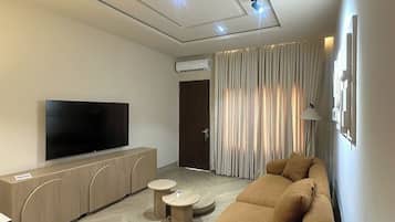 Apartament Deluxe, balcó, vistes a la ciutat | Sala d'estar