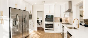Spacious 7BR home featuring a private pool, separate pool house, game room, Peloton-equipped workout sunroom, dedicated office, multiple living areas, and a fully equipped kitchen—perfect for families, groups, and extended stays.