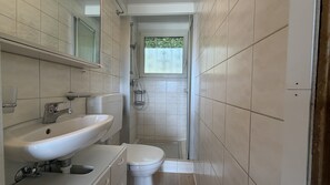 A bathroom with a sink, toilet, and shower. - Casa Ines with Lake Maggiore View (Villaggio Olandese)