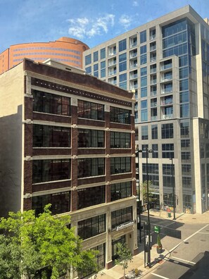 A multi-story building with large windows and a brick facade.