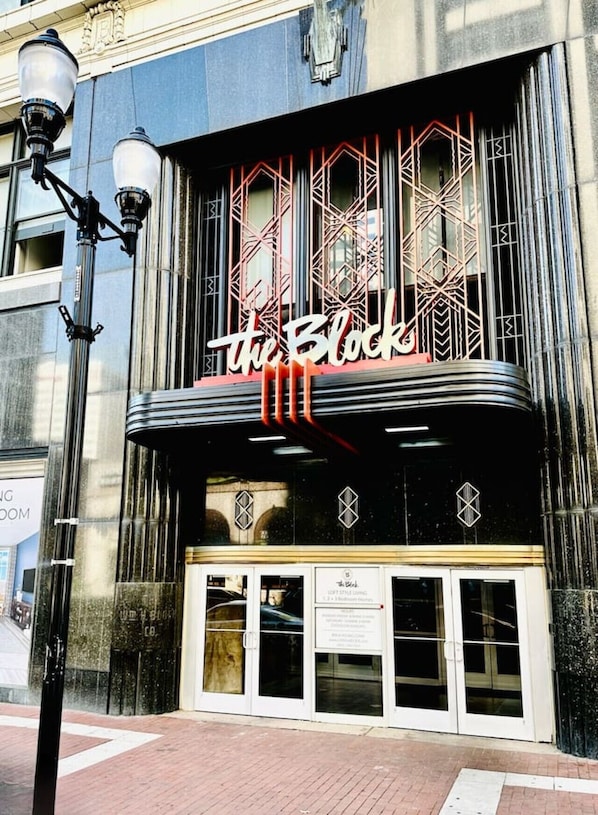 A theater with a marquee reading 'the Block,' large windows, and a black facade. - King Suite on The Circle by Convention Center (Indianapolis)