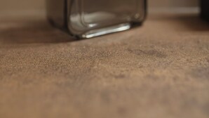A clear glass bottle with a pump dispenser, placed on a textured surface. - New TENUTA MARELLA Farmstay, nestled in the countryside just outside Rome (Lazio)