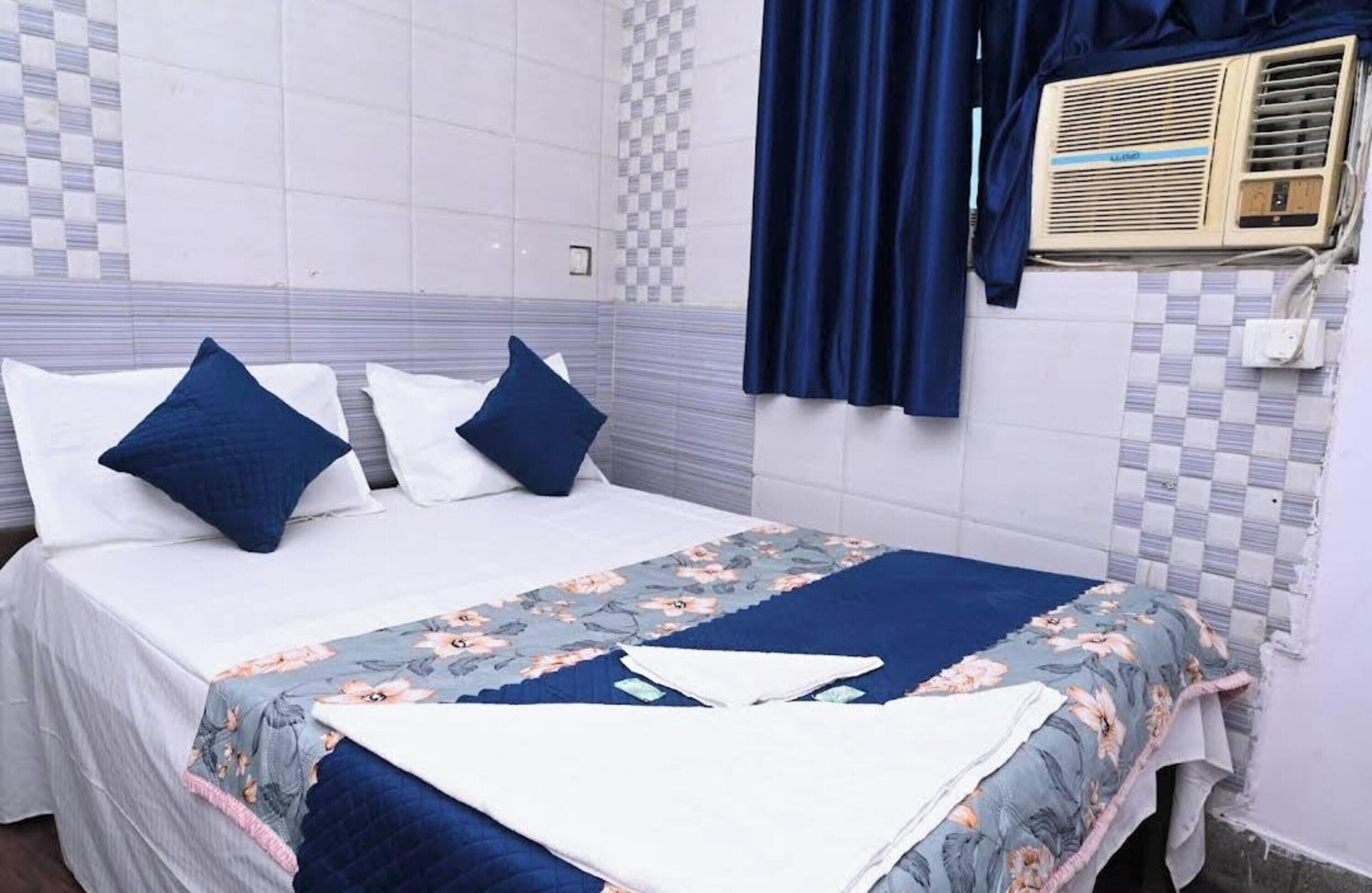 Habitación Deluxe | Camas supletorias y ropa de cama