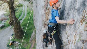 A person climbing a rock wall.