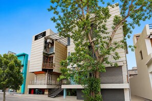A modern building with a sign reading 'Athena Hotel.' - Classic Hotel Navjivan (Ahmedabad)