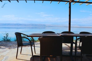 Outdoor dining - J Apartments - 1BR @Dead Sea Resort "C12" (Dead sea hotels area next to convention center)