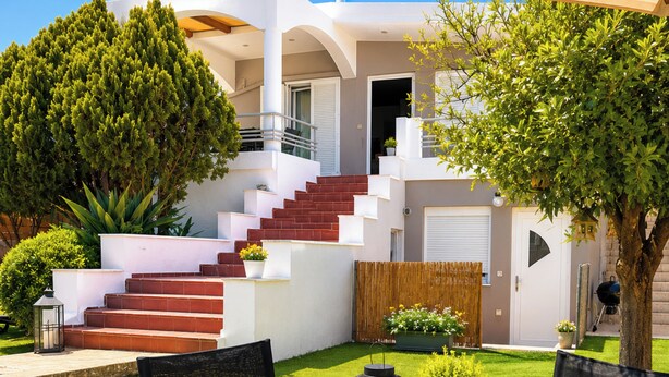 A modern house with a staircase, outdoor seating, and a well-maintained lawn. - Villa Morea With Pool Near Chania City (Chania)