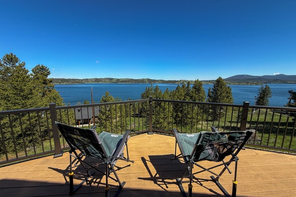 A great spot for coffee on a crisp Montana morning. The spacious deck offers expansive views of the lake and surrounding mountains.