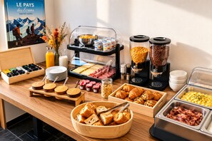 A breakfast buffet with various food items, including pastries, meats, and beverages.