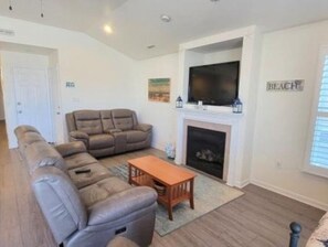Smart TV, fireplace, books