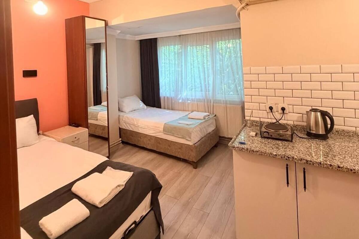 Quarto triplo standard, cozinha americana | Roupas de cama premium, Wi-Fi de cortesia, roupa de cama