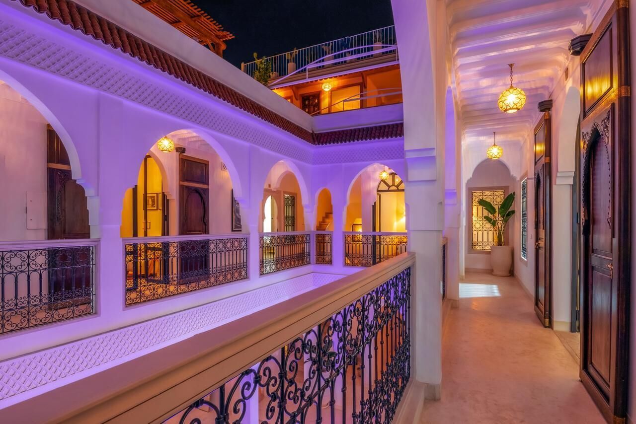 A multi-level courtyard with arched walkways and a balcony.