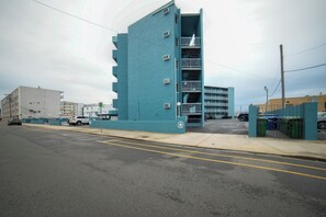 A multi-story building with balconies, a parking lot, and a street view. - 2 Block to Beach & Boardwalk! Wildwood Studio (Wildwood)