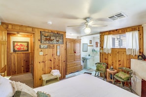 A wooden room with a bed, a ceiling fan, a sink, and a window with curtains. - Year-round Mtn Escape in the 'arizona Rockies' (Lakeside)