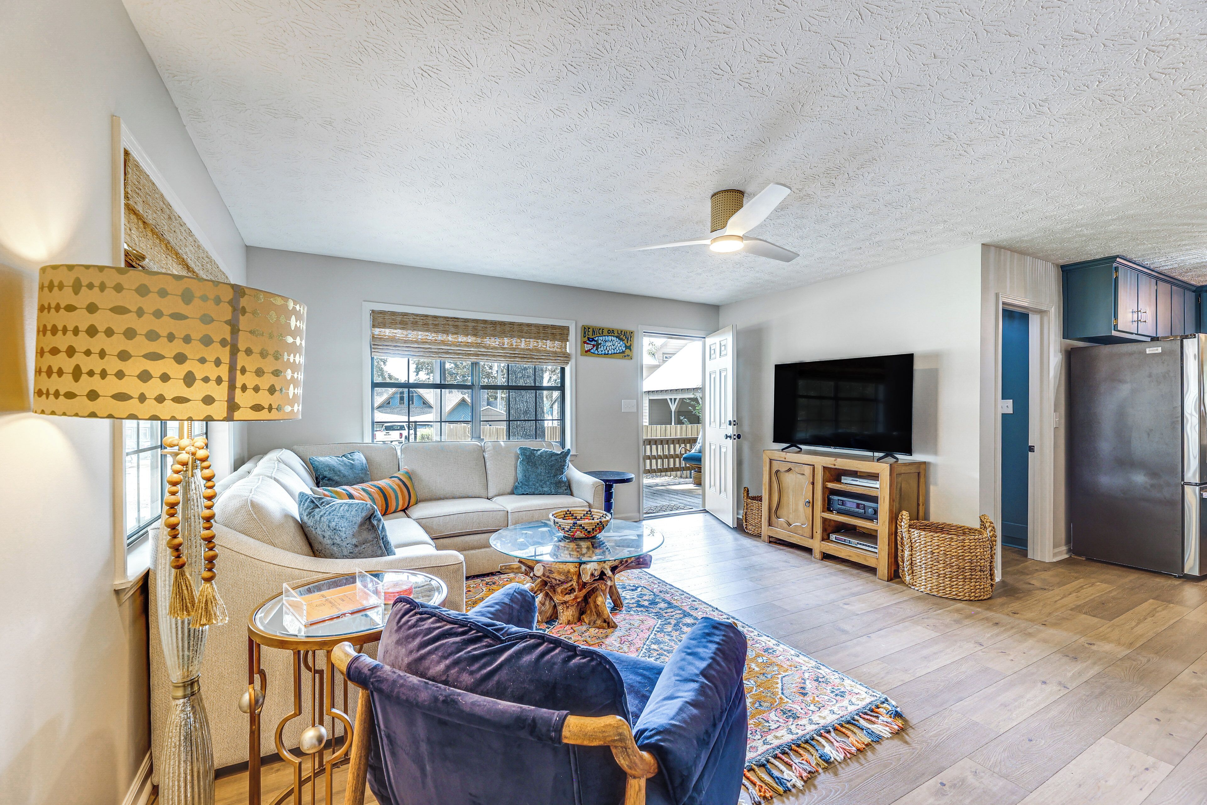 A living room with a sofa, coffee table, and TV.