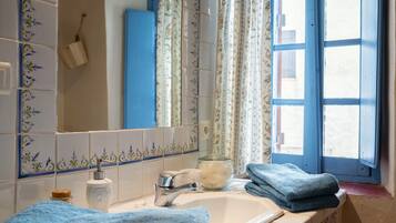 Shower, hair dryer, towels, toilet paper