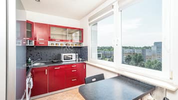 Suite estudio, balcón | Cocina privada