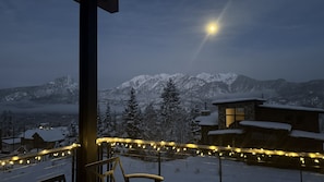 A snow-covered mountain landscape with a cabin and string lights. - Brand new home at Purgatory Resort - Hot Tub/Sauna/3 Decks/AC/Amazing Views (Durango)