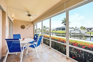 Outdoor dining - New! Waterfront Cape Coral Condo | Pool & Lanai | Walk to Dining & Shopping (Cape Coral)