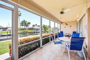 Outdoor dining - New! Waterfront Cape Coral Condo | Pool & Lanai | Walk to Dining & Shopping (Cape Coral)