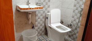 Deluxe Room | Bathroom | Shower, slippers, soap, shampoo - Hotel satyam swagat (Haridwar)