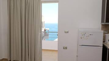 Apartamento, sacada, vista para o mar | Parte interna