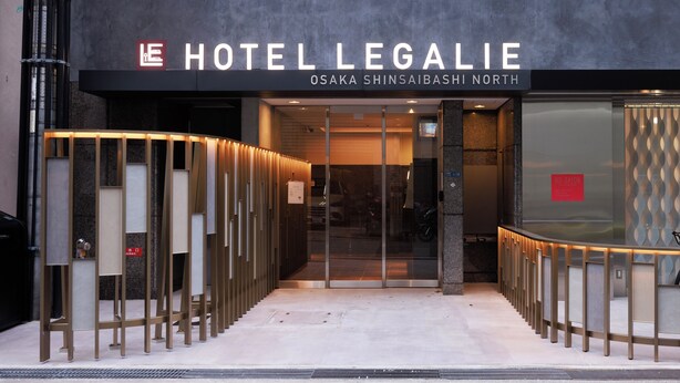 The entrance to Hotel Legalie with a modern design, including a glass door and a metal railing. - HOTEL LEGALIE Osaka Shinsaibashi North (Osaka)