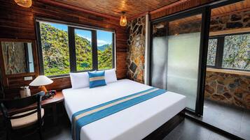 Deluxe Room, Patio, Mountain View | Desk, soundproofing, iron/ironing board, free WiFi