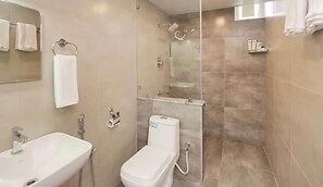 A bathroom with a sink, toilet, and shower. - Collection O Kengeri Bus Terminal (Bengaluru)