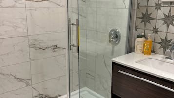 Shower, towels, soap, toilet paper